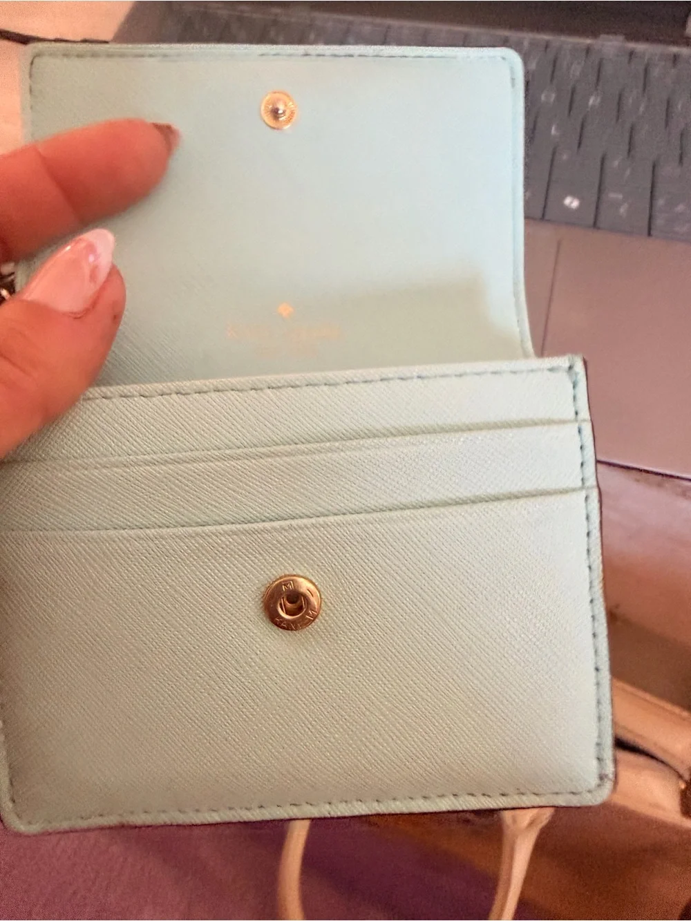 kate spade light mint leather compact wallet with gold logo plaque